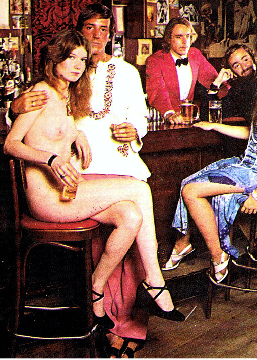 A retro photo of a naked woman in a bar with a clothed man